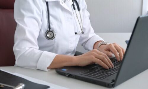 doctor-practitioner-typing-on-laptop-1024x682-1-e1656722156798.jpg